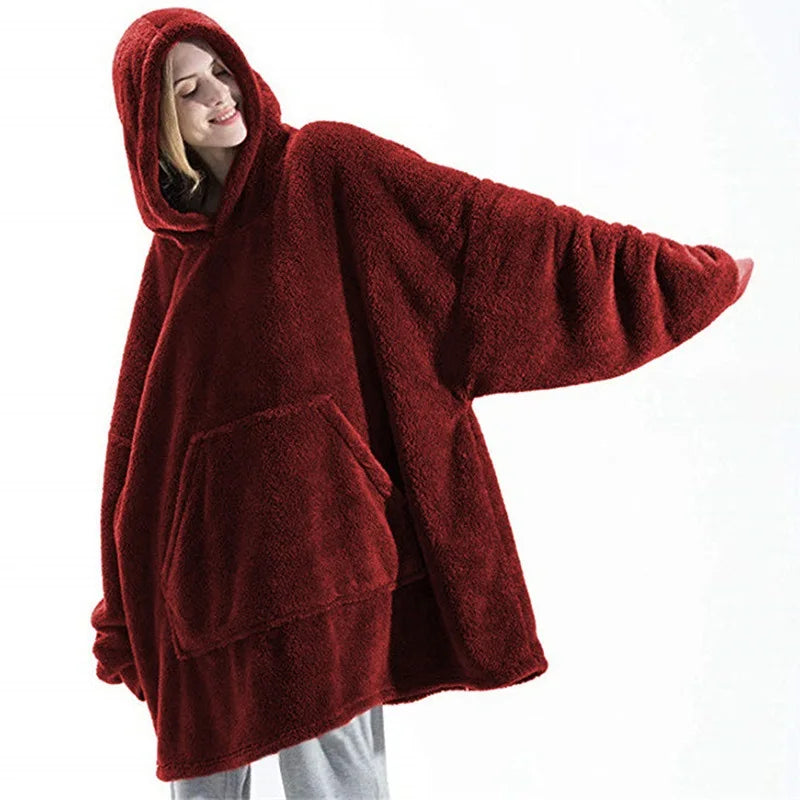 Person wearing a large red fleece hoodie on a white background