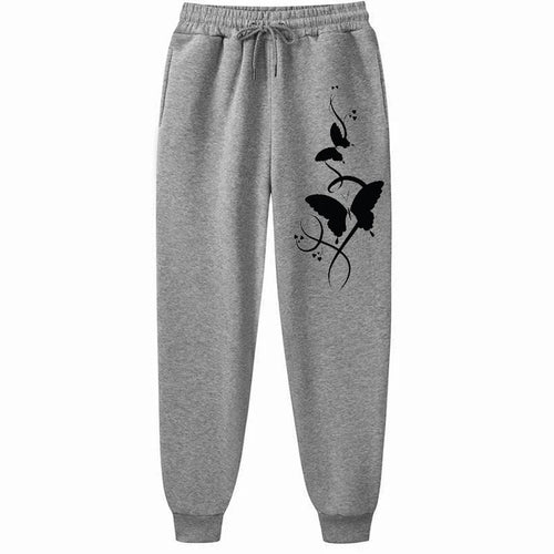 Gray sweatpants with black butterfly design on a white background