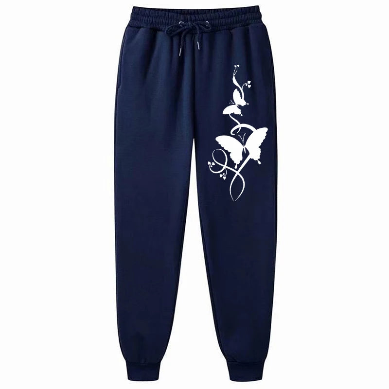 Navy blue sweatpants with a white floral design on a white background