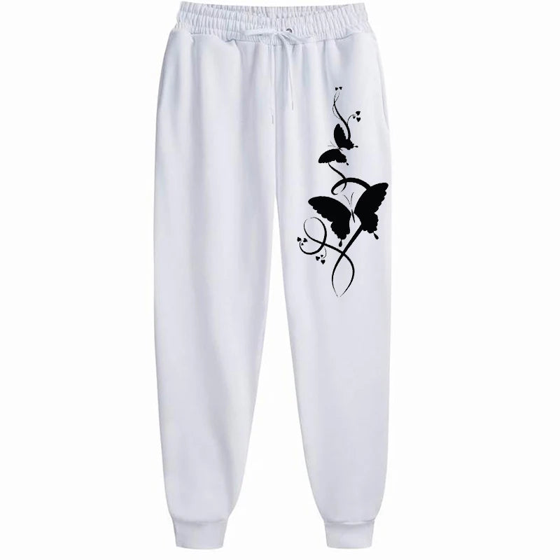 White sweatpants with black butterfly design on a white background